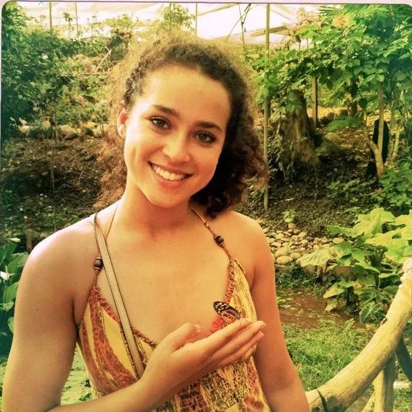 A young Madison Alworth outdoors among greenery