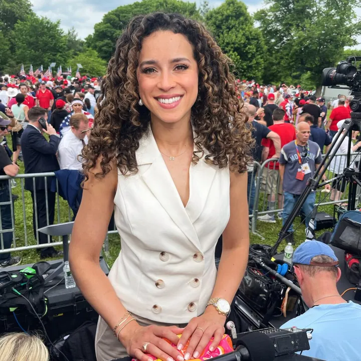 Madison Alworth covering a crowded outdoor event