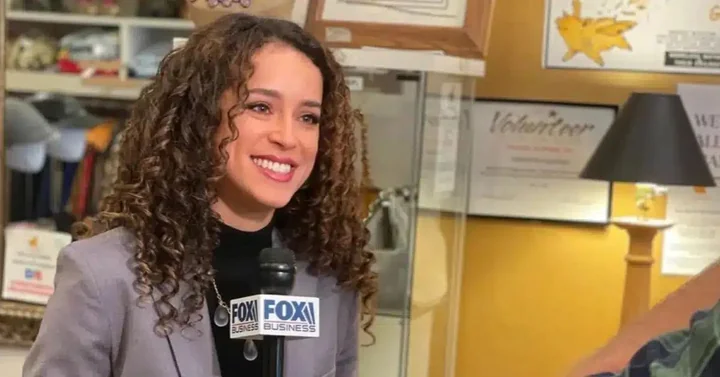 Madison Alworth interviewing inside a small business with a Fox microphone