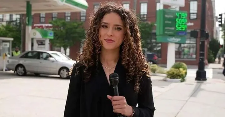 Madison Alworth doing a street report with a microphone