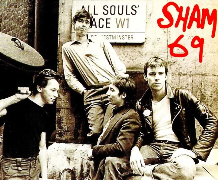 Sham 69 photographed at All Souls Place, with the band's name written across the image