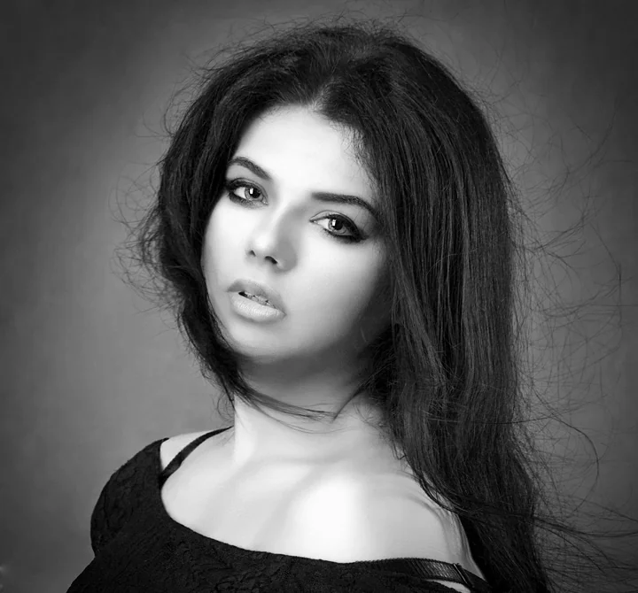 A black and white portrait of a woman