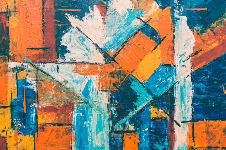 An abstract painting in orange, blue and white