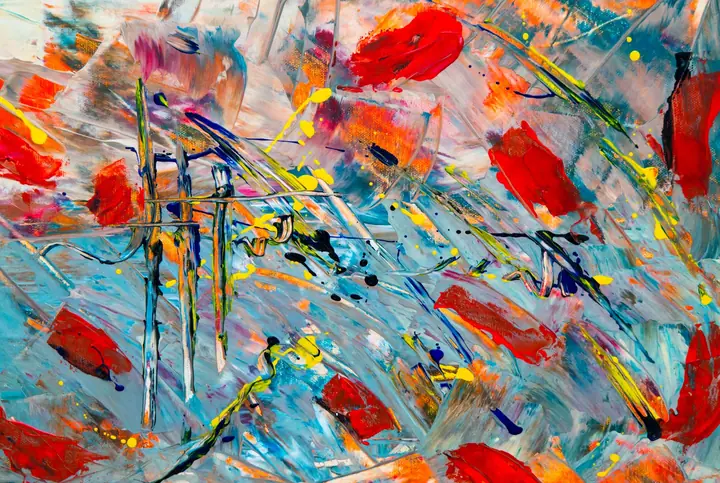 A palette of mixed oil paints with brushes