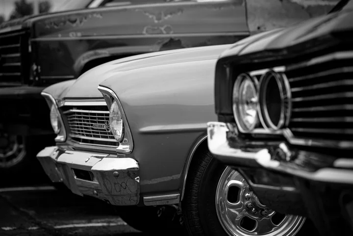 The front of a classic car photographed in black and white