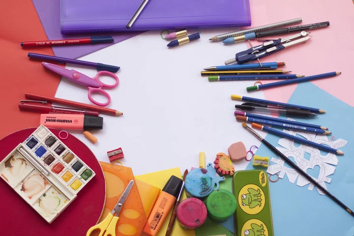 Art materials laid out on a bright background