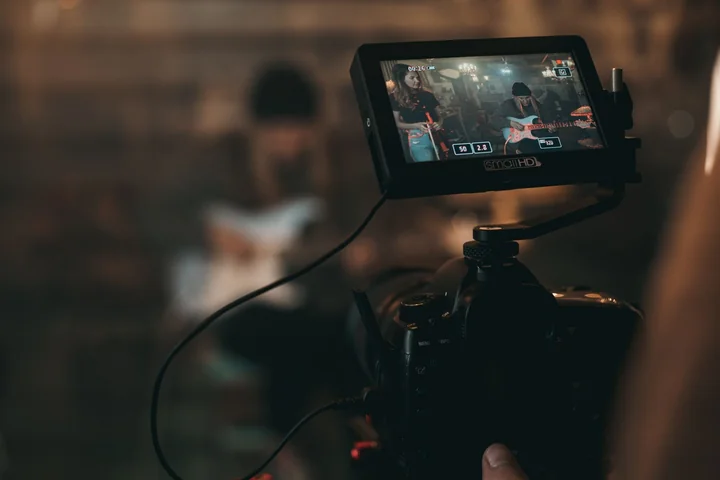 A camera monitor showing a scene being filmed