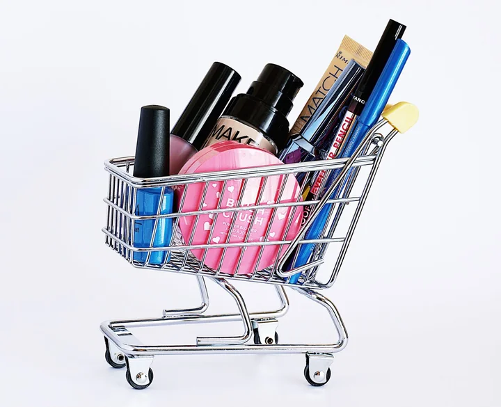 A miniature trolley filled with cosmetics