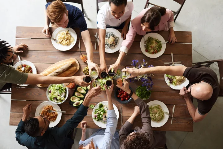 Friends eating together at a table, seen from above