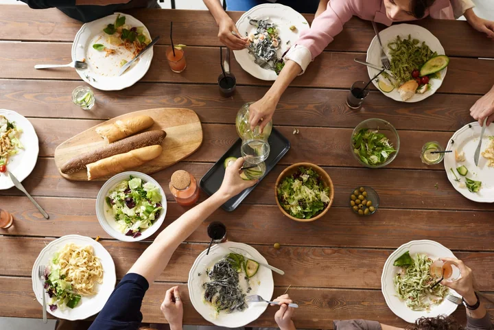 A shared meal spread across a wooden table