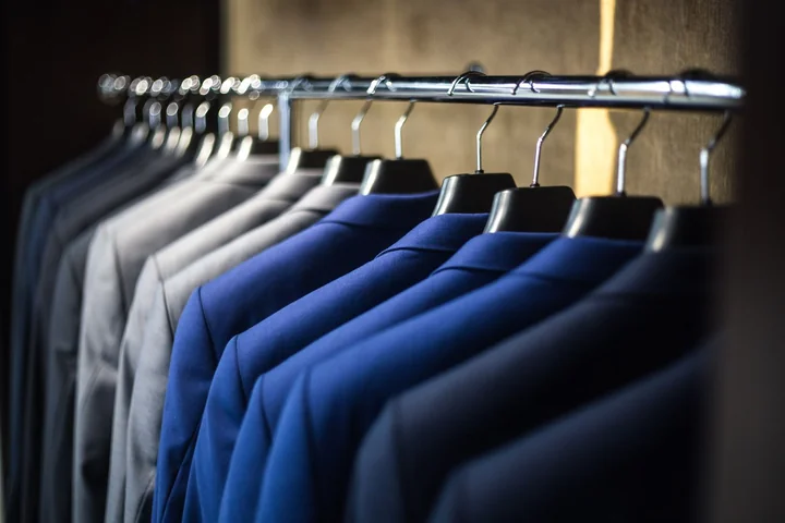 A rail of pressed shirts on hangers