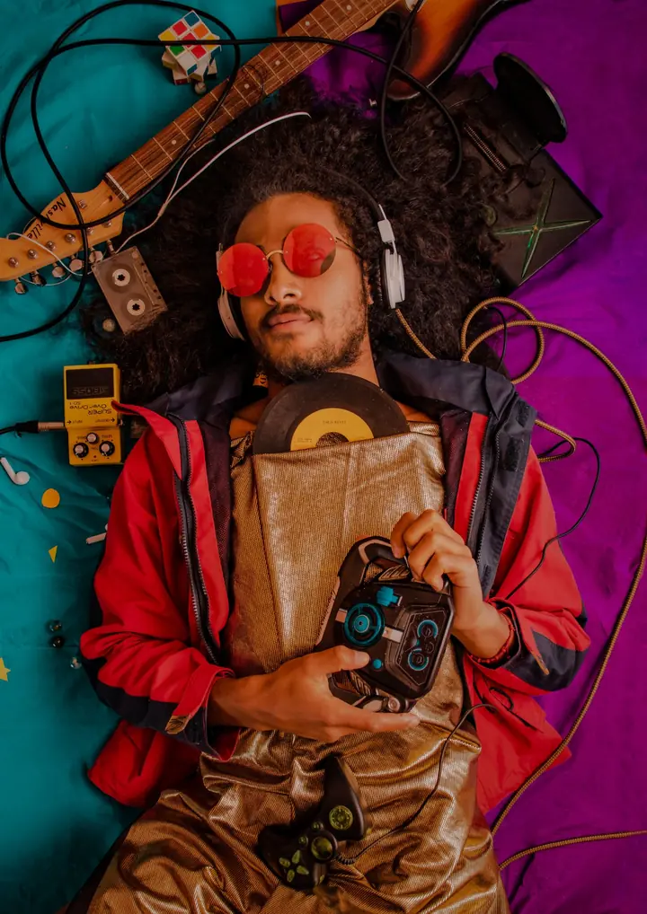 A brightly lit portrait of a person holding a camera