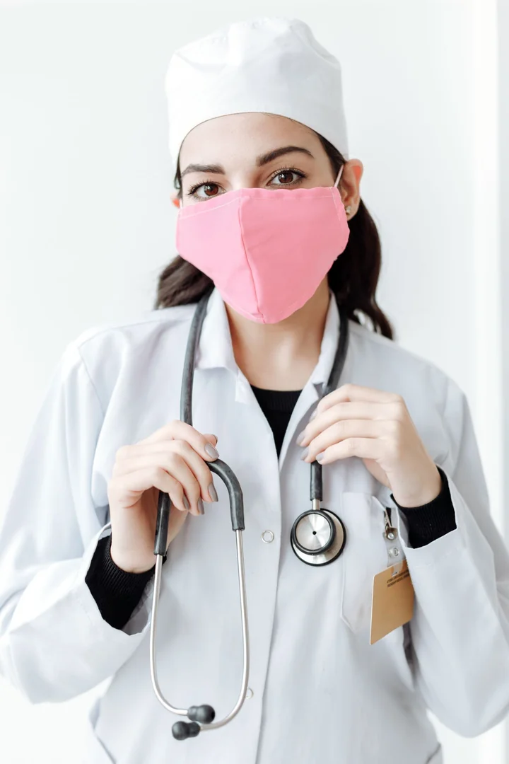 A medical worker in a mask with a stethoscope