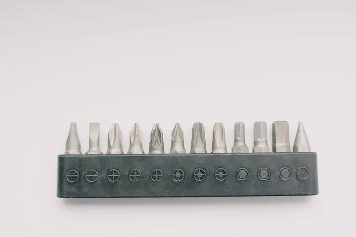 A row of screwdriver bits in a holder