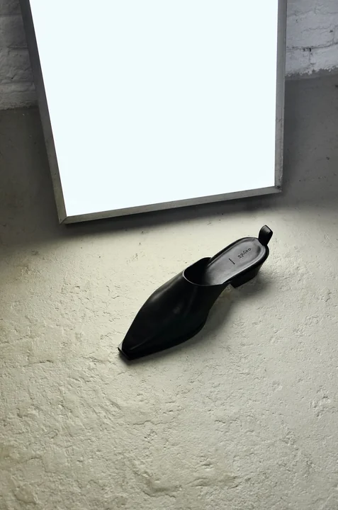 A framed picture leaning against a wall