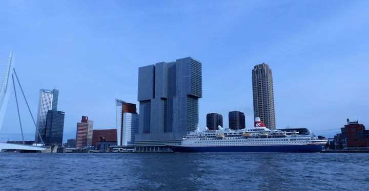 A city waterfront with modern towers