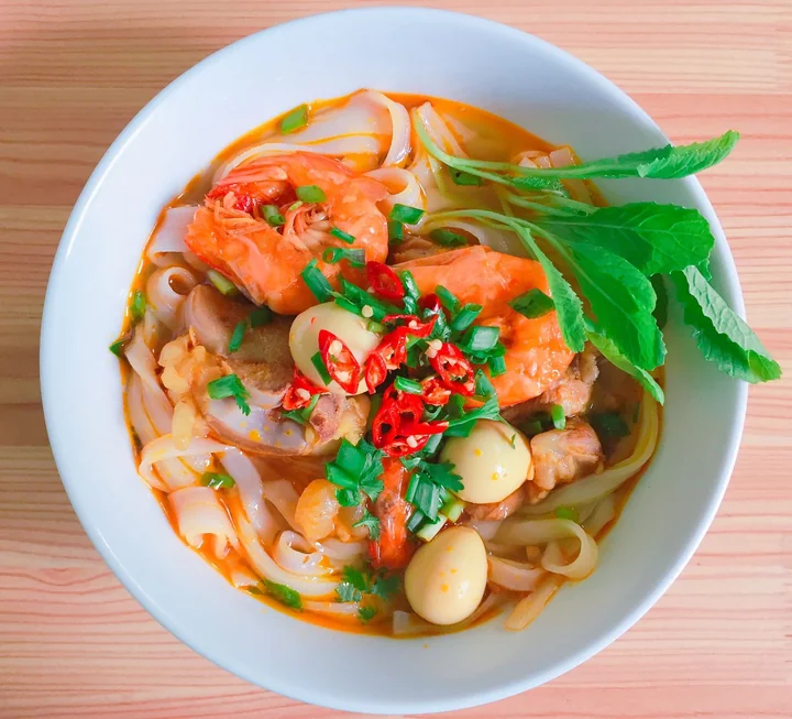 A bowl of prawn and noodle soup