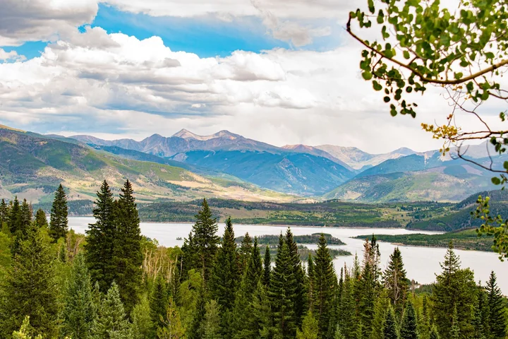 Mountains and forest above a still lake