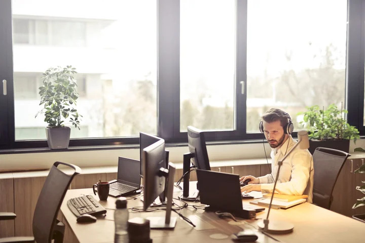 An open plan office with people working at desks