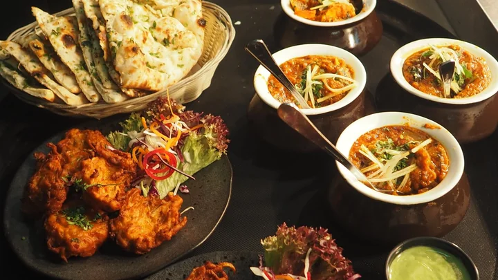 A spread of curries, fritters and flatbreads
